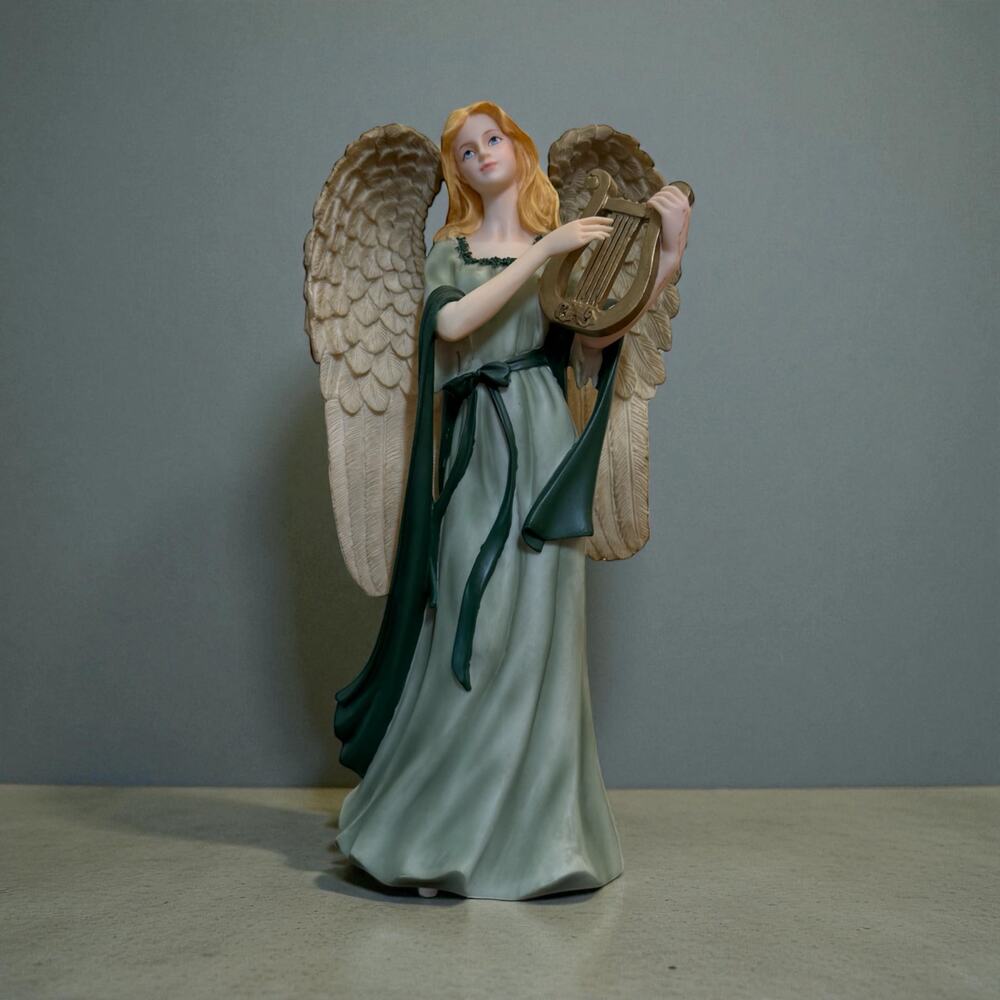 Sankyo porcelain angel figurine music box.